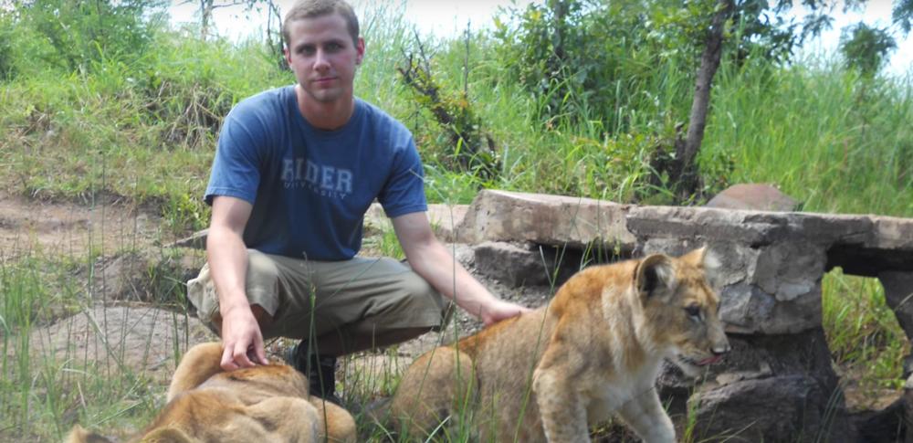 Student with Lion cubs